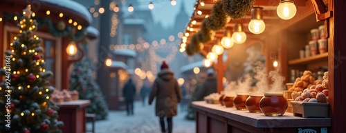 Festive Christmas market with glowing lights against snowy evening backdrop