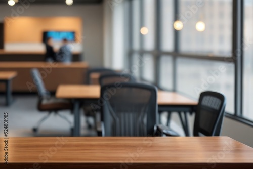 Wooden table top over a blurry office