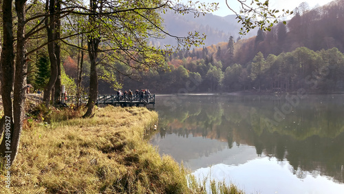 Karagöl, Borçka, Artvin, Turkey - 14 October 2021. Autumn view from Karagöl in Borçka district of Artvin province. Borcka Karagol Nature Park. The forest scene reflected in the still lake. photo