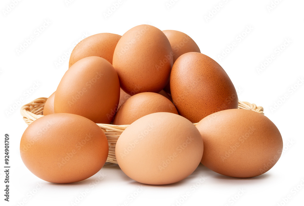 Fresh brown chicken eggs in stack in wicker basket isolated on white background with clipping path Fresh brown chicken eggs in stack in wicker basket isolated on white background with clipping path