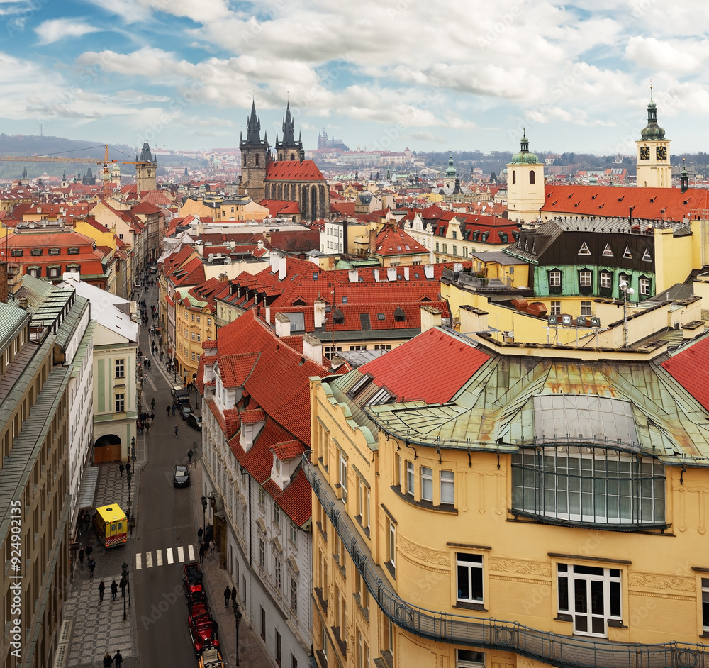 Fototapeta premium Scenic sight of the historical center of Prague, Czech Republic from a bird’s eye view. Buildings and landmarks of old town with red rooftops and multi-colored walls