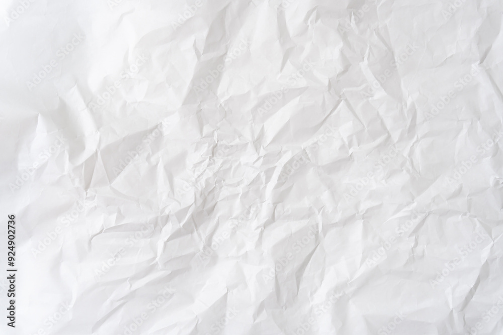 Top view and full frame of white wrinkled or crumpled stencil paper background texture used for crumpled paper background texture in decorative art work Top view and full frame of white wrinkled or crumpled stencil paper background texture used for crumpled paper background texture in decorative art work