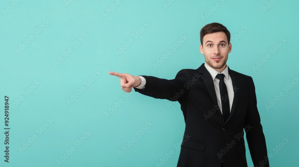 Businessman in a suit confidently pointing ahead Businessman in a suit confidently pointing ahead