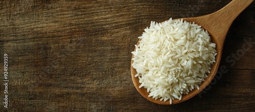 jasmine rice on a wooden sp...