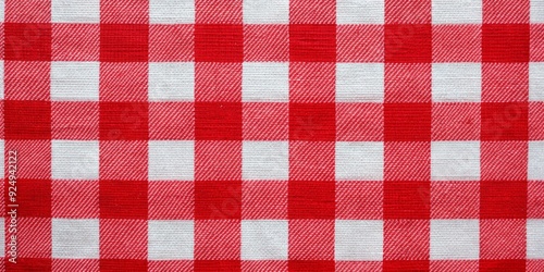 Vibrant red and white checkered fabric features a bold, repetitive pattern with bright, saturated colors that create a striking visual effect in high contrast.