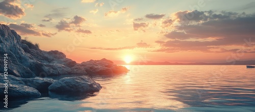 sunset on rocks by the ocea...