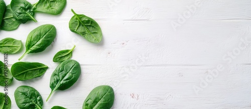 Baby spinach leaves on a wh...