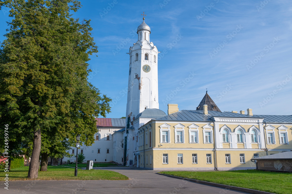 View of the ancient clock tower (Chasozvonya) on a sunny July morning. Kremlin of Veliky Novgorod View of the ancient clock tower (Chasozvonya) on a sunny July morning. Kremlin of Veliky Novgorod