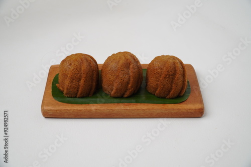 Harum Manis Padang is a traditional Indonesian cake isolated on a white background photo