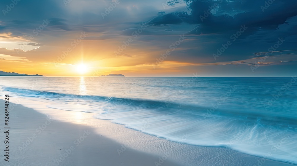 Obraz premium Serene Sunset Beach Scene with Seagull in Distance