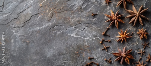 Star anise spice closeup on gray stone background with available copy space image photo