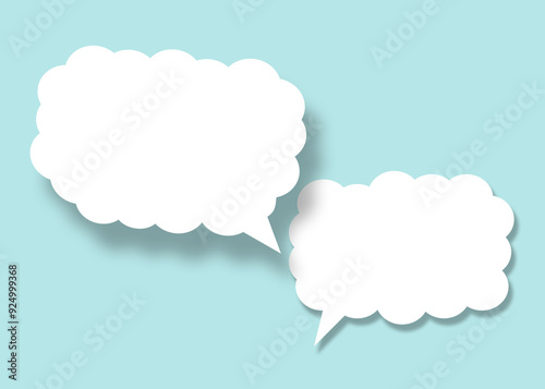 Empty white cloud paper speech bubble shape against light blue background.