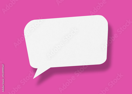 Empty speech balloon shape white paper isolated on pink background communication bubbles.