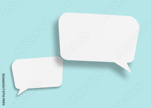 Empty speech balloon shape white paper isolated on light blue background communication bubbles.