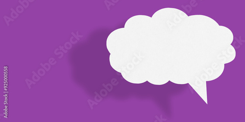 Empty white cloud paper speech bubble shape against purple background.