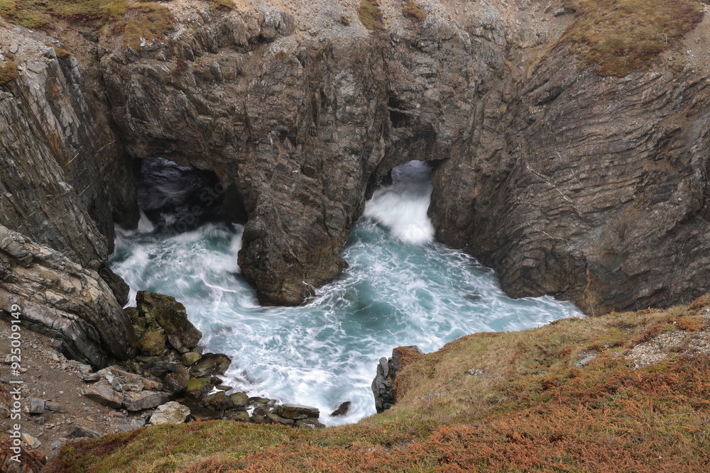 Obraz premium Sea caves and arches at Dungeon Provincial Park near Bonavista, Newfoundland, Canada