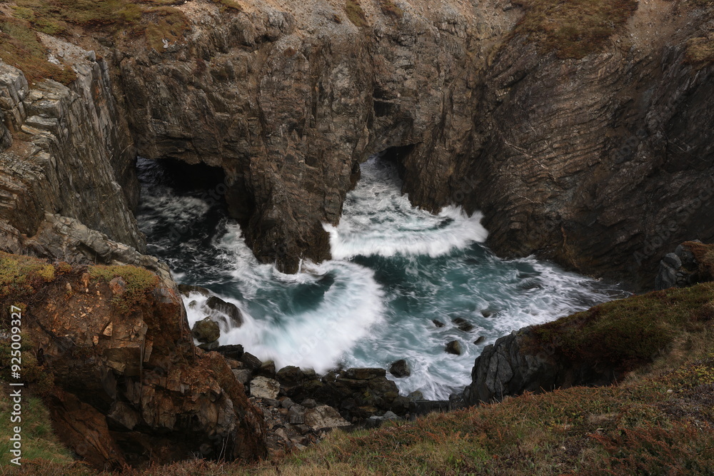 Obraz premium Sea caves and arches at Dungeon Provincial Park near Bonavista, Newfoundland, Canada