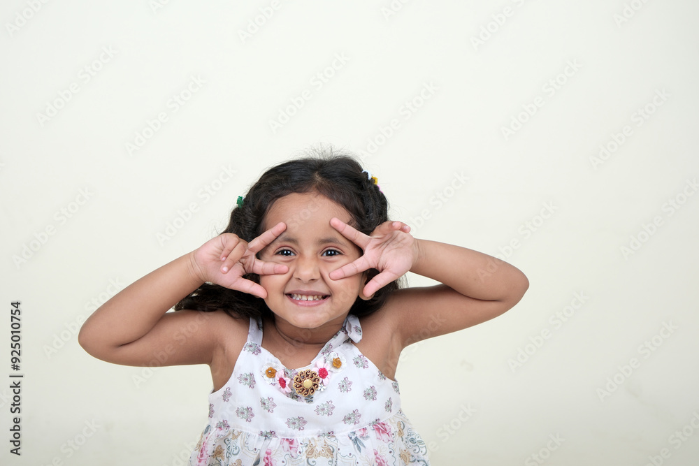A delightful little girl with sparkling eyes, breaking into a wide, infectious smile. Her expression radiates pure happiness and innocence. A delightful little girl with sparkling eyes, breaking into a wide, infectious smile. Her expression radiates pure happiness and innocence.