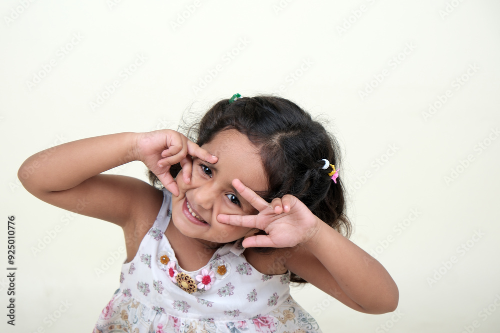 A delightful little girl with sparkling eyes, breaking into a wide, infectious smile. Her expression radiates pure happiness and innocence. A delightful little girl with sparkling eyes, breaking into a wide, infectious smile. Her expression radiates pure happiness and innocence.