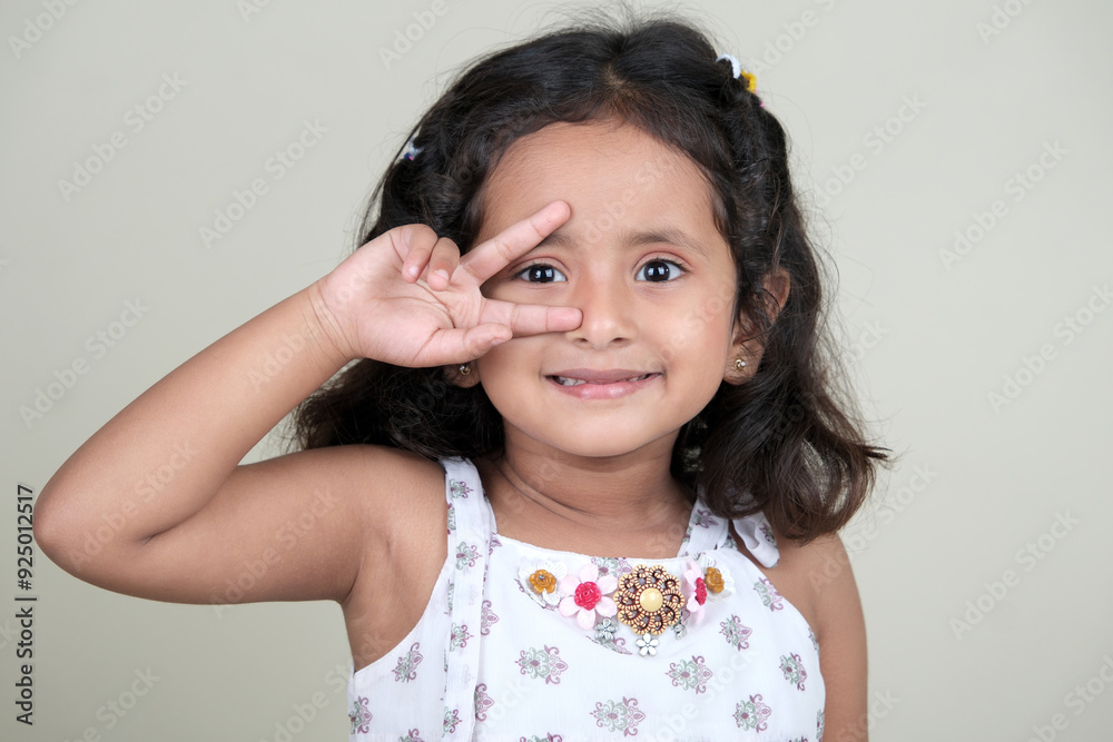 A delightful little girl with sparkling eyes, breaking into a wide, infectious smile. Her expression radiates pure happiness and innocence. A delightful little girl with sparkling eyes, breaking into a wide, infectious smile. Her expression radiates pure happiness and innocence.