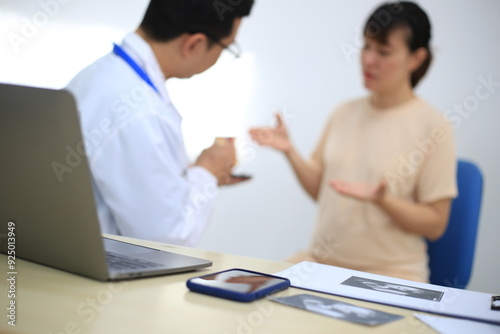 Male doctor with experience examining young pregnant women