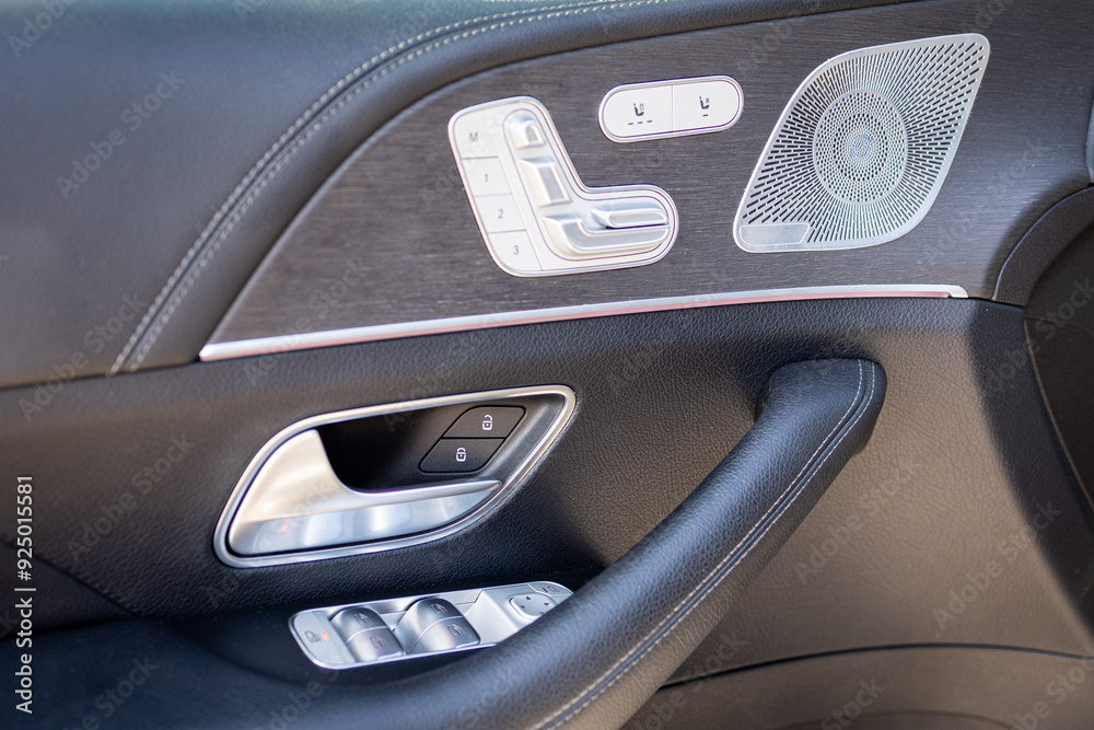 Car interior. Front door panel on modern luxury car Car interior. Front door panel on modern luxury car