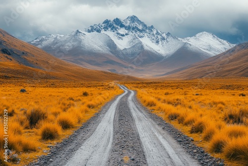 Empty off-road track with mountain background, muddy and uneven dirt road