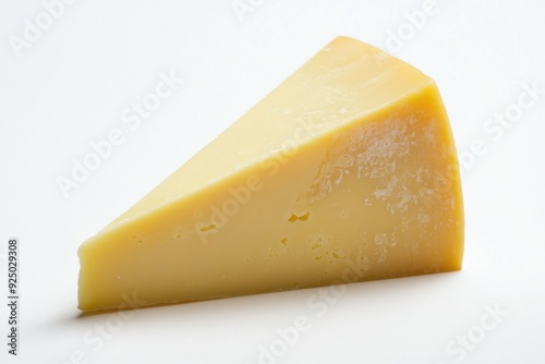 Aged cheddar cheese wedge on a light background photo