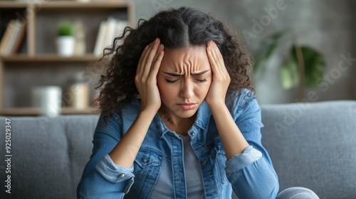 Woman Feeling Lightheaded and Resting photo