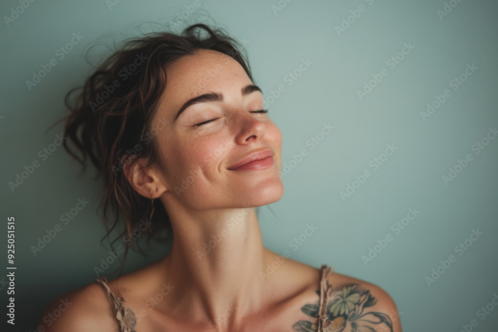 A close up of a woman's face with tattoos and her eyes closed A close up of a woman's face with tattoos and her eyes closed