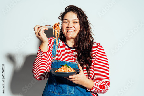 Plus size woman model posing in studio and having fun