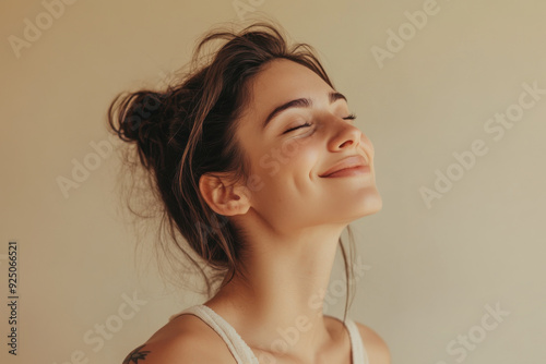 A close up of a woman's face with tattoos and her eyes closed