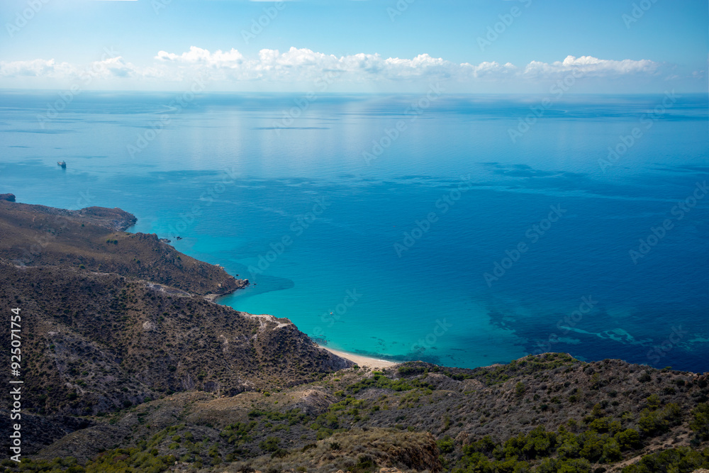 View from above of the paradisiacal Fatares Beach in Cartagena, Region of Murcia, Spain on a calm summer day View from above of the paradisiacal Fatares Beach in Cartagena, Region of Murcia, Spain on a calm summer day
