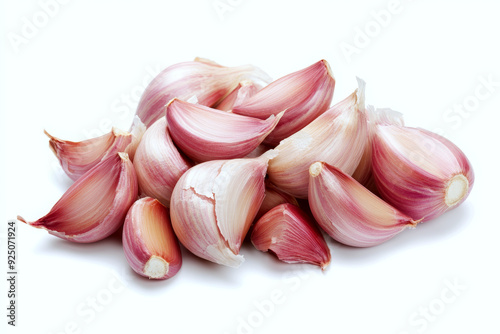 Fresh organic garlic cloves isolated on white background.