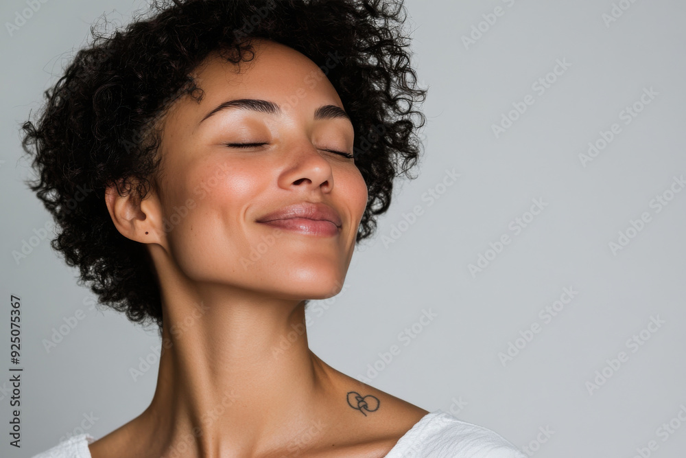 A close up of a woman's face with tattoos and her eyes closed A close up of a woman's face with tattoos and her eyes closed