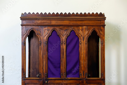 wooden confessional inside a church photo