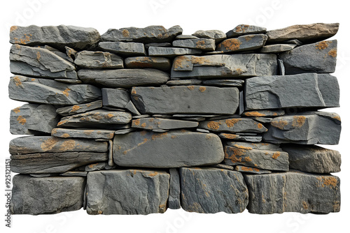 Horizontally stacked dry stone wall made of large, irregular, gray stones with orange lichen spots. photo