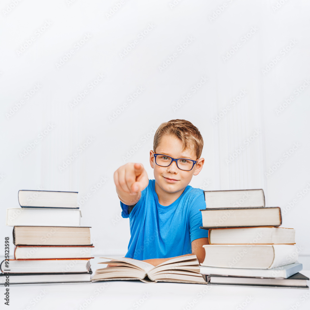 Self-confident school child pointing finger at camera. Successfully back to school. Self-confident school child pointing finger at camera. Successfully back to school.