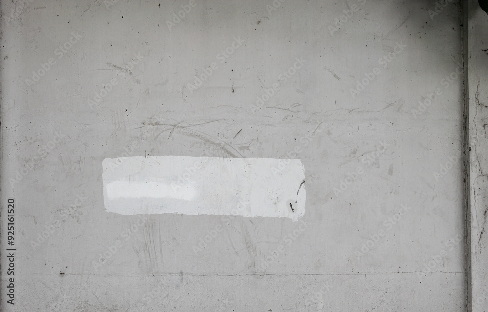White color paint on old concrete wall to remove dirty patterns or letters.
