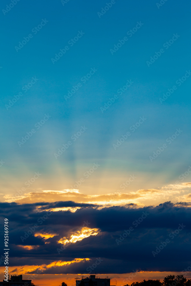 Fototapeta premium Sunrset with dramatic sky. Cloudy sky at sunset. Sky at Sunset Sunrise with real sun and clouds. Real sunset sky, colorful sky during sunset or sunrise, weather, colorful colors of the sky.