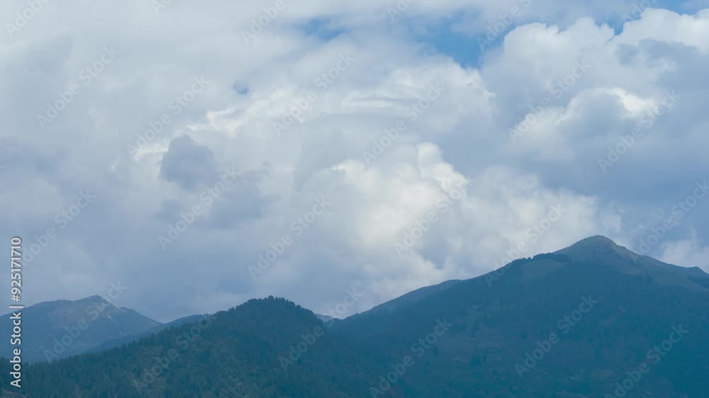 4K Time lapse shot of dark monsoon stormy clouds above the Himalayan mountain range as seen from Naggar town near Manali in Himachal Pradesh, India. Dark clouds bringing rain to the mountains. 4K Time lapse shot of dark monsoon stormy clouds above the Himalayan mountain range as seen from Naggar town near Manali in Himachal Pradesh, India. Dark clouds bringing rain to the mountains.