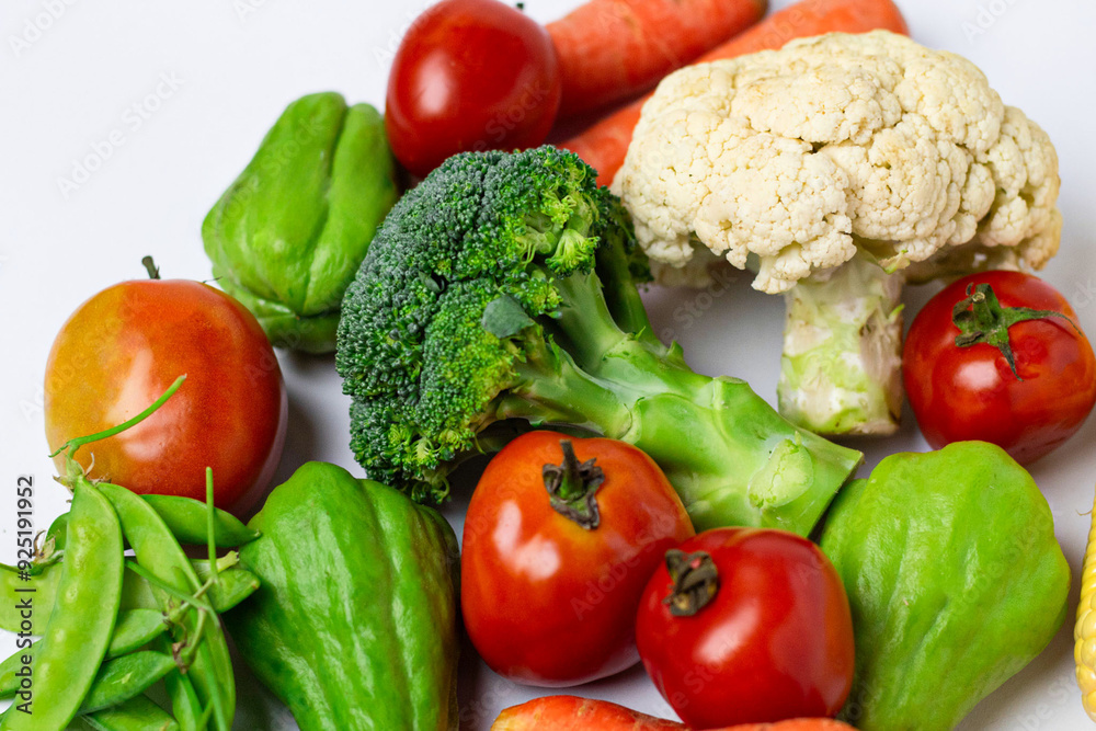Assorted fresh vegetables on isolated white background, showing various colors and textures Assorted fresh vegetables on isolated white background, showing various colors and textures