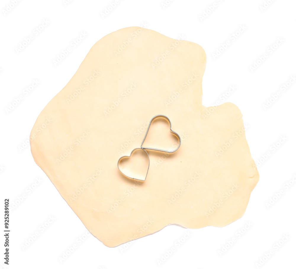Raw dough and cookie cutters isolated on white, top view Raw dough and cookie cutters isolated on white, top view