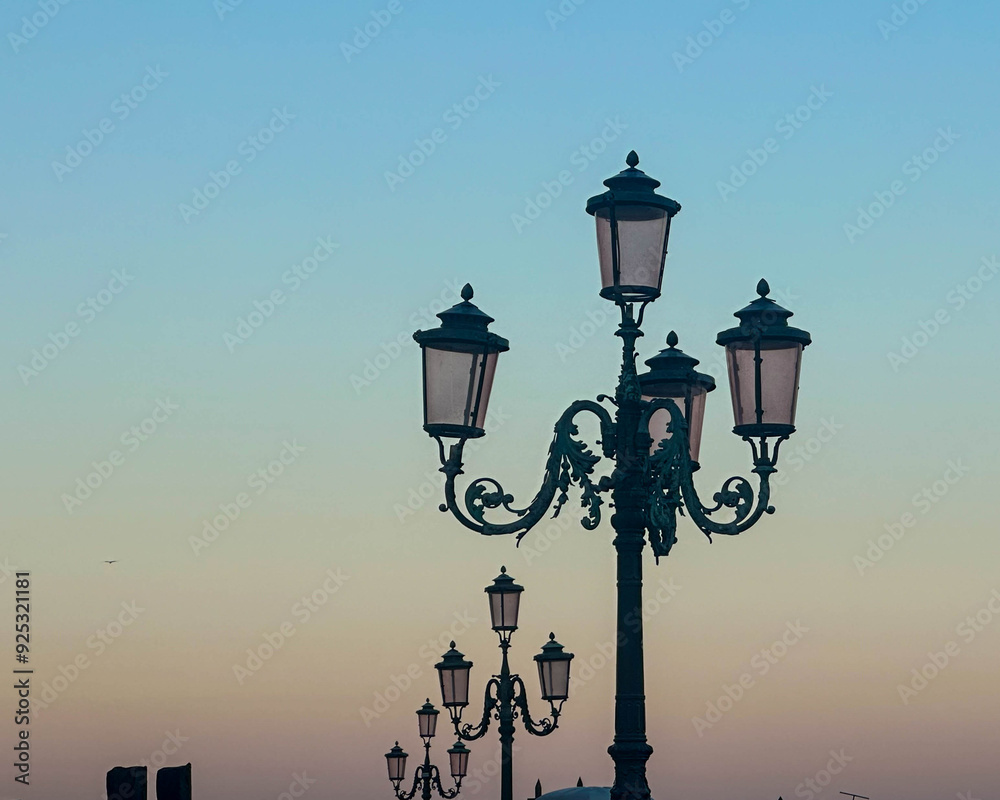 Obraz premium street lamps in the evening