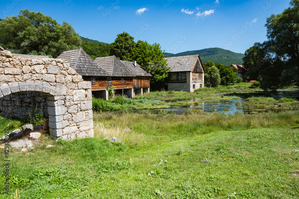 Fototapeta premium Majerovo Vrilo, beautiful wooden mill houses on the spring of Gacka river, Croatia, one of the last mills preserved in this mountain region