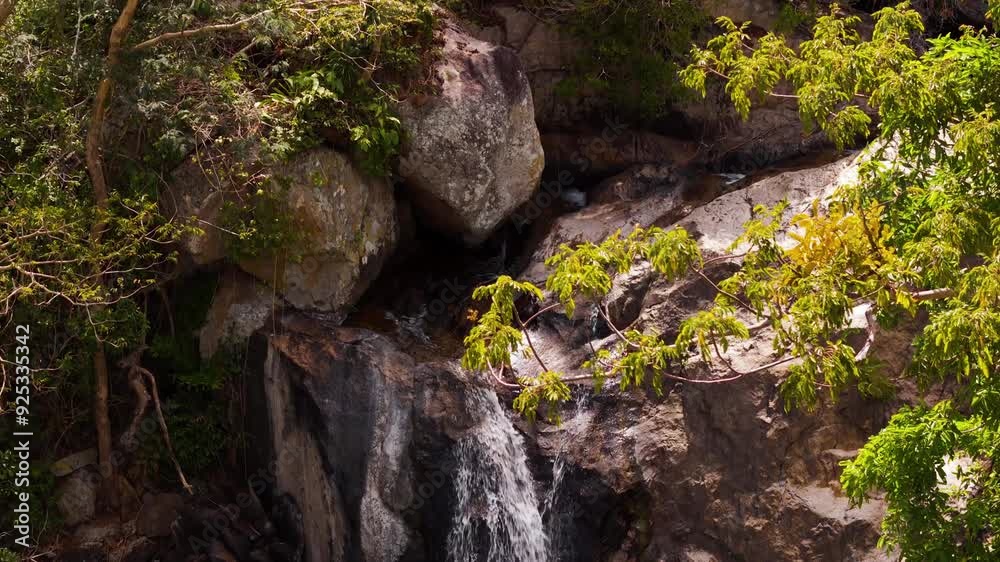 Beautiful Jungle Waterfall Cascading Into A Refreshing Swimming Hole In Central Vietnam. Aerial Crane Shot (Top To Bottom) View Of The Fall. Beautiful Jungle Waterfall Cascading Into A Refreshing Swimming Hole In Central Vietnam. Aerial Crane Shot (Top To Bottom) View Of The Fall.