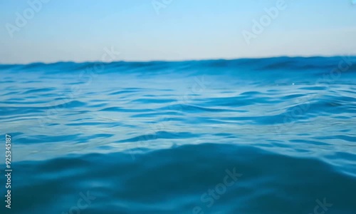 Wallpaper Mural Calm blue ocean water waves under clear sky on a peaceful day Torontodigital.ca