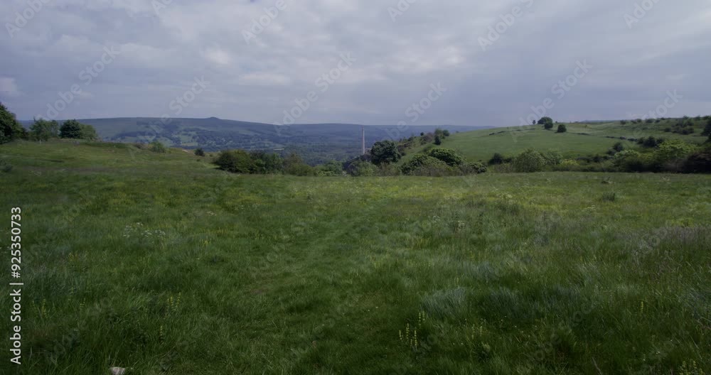 Extra wide shot of open fields with factory chimney and the great Ridge in background taken on siggate road Extra wide shot of open fields with factory chimney and the great Ridge in background taken on siggate road