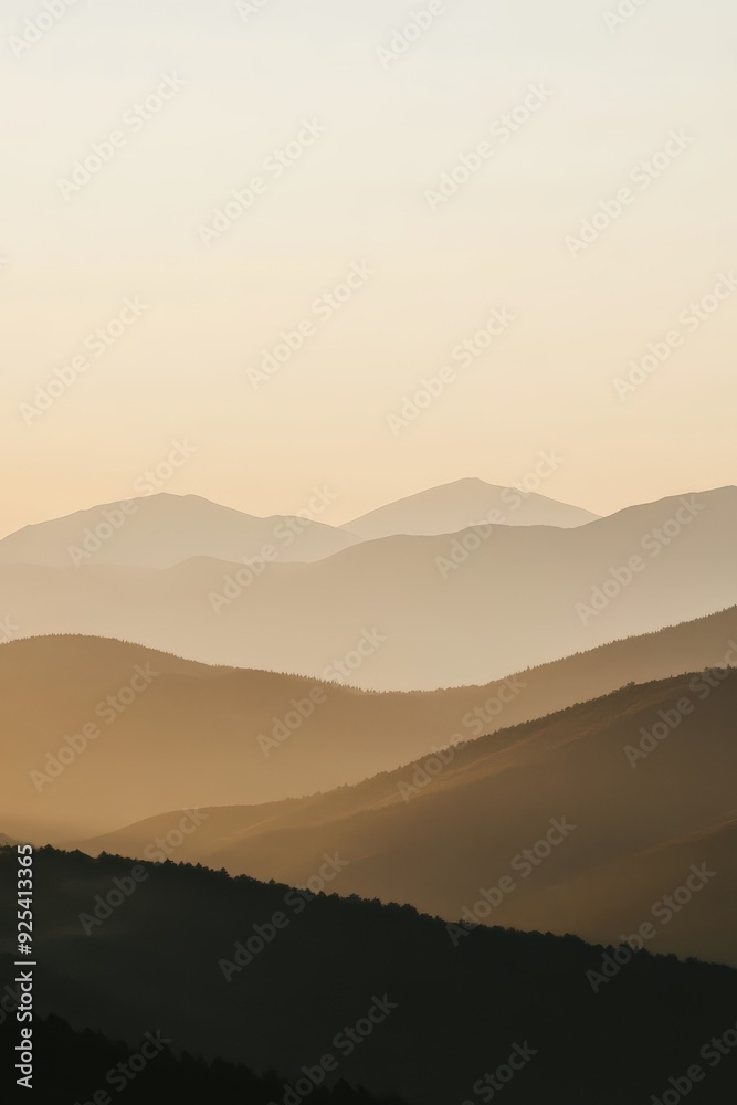 Evening fog envelops mountains in a tranquil landscape Evening fog envelops mountains in a tranquil landscape