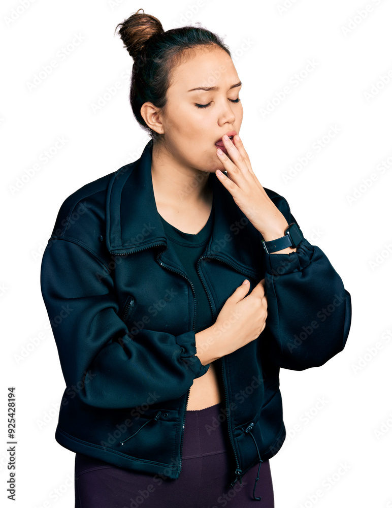 Young hispanic girl wearing sportswear bored yawning tired covering mouth with hand. restless and sleepiness. Young hispanic girl wearing sportswear bored yawning tired covering mouth with hand. restless and sleepiness.